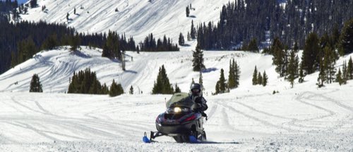 Snowmobiling the groomed trails outside Grand Lake