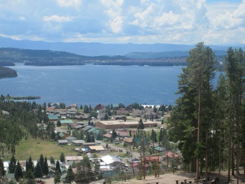 The village on the shoreline, with the lake reaching to the ranges beyond